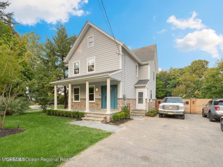 Discover a 1909 Gem in West Long Branch, New Jersey with Expansive Backyard, Custom Fire Pit, and Ample Space for Entertaining