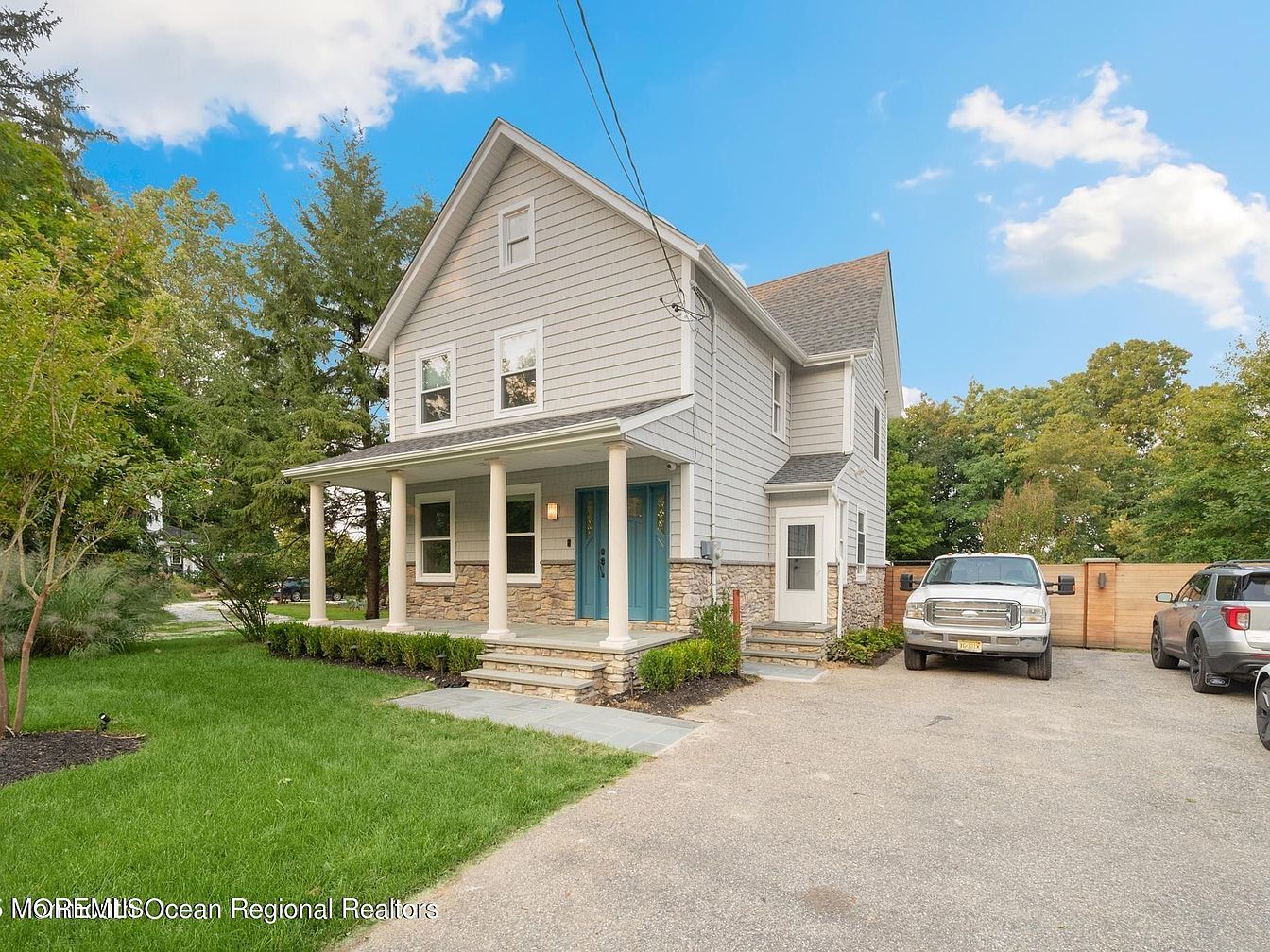 Discover a 1909 Gem in West Long Branch, New Jersey with Expansive Backyard, Custom Fire Pit, and Ample Space for Entertaining