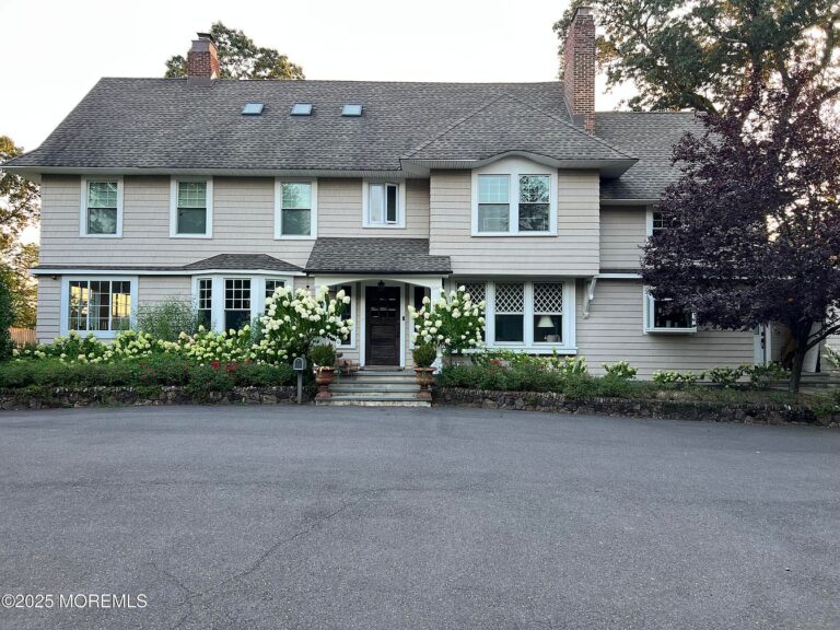 Luxurious Riverfront 1920 Home in Tinton Falls, New Jersey, with Sun-Drenched Interiors, Two Cozy Fireplaces, and Private Balconies