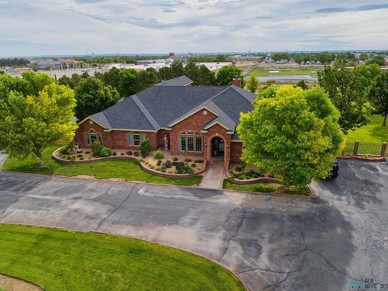 Luxurious 2004 All-Brick Home in Artesia, New Mexico, Nestled on 7 Wooded Acres with a Heated Saltwater Pool and Media Room