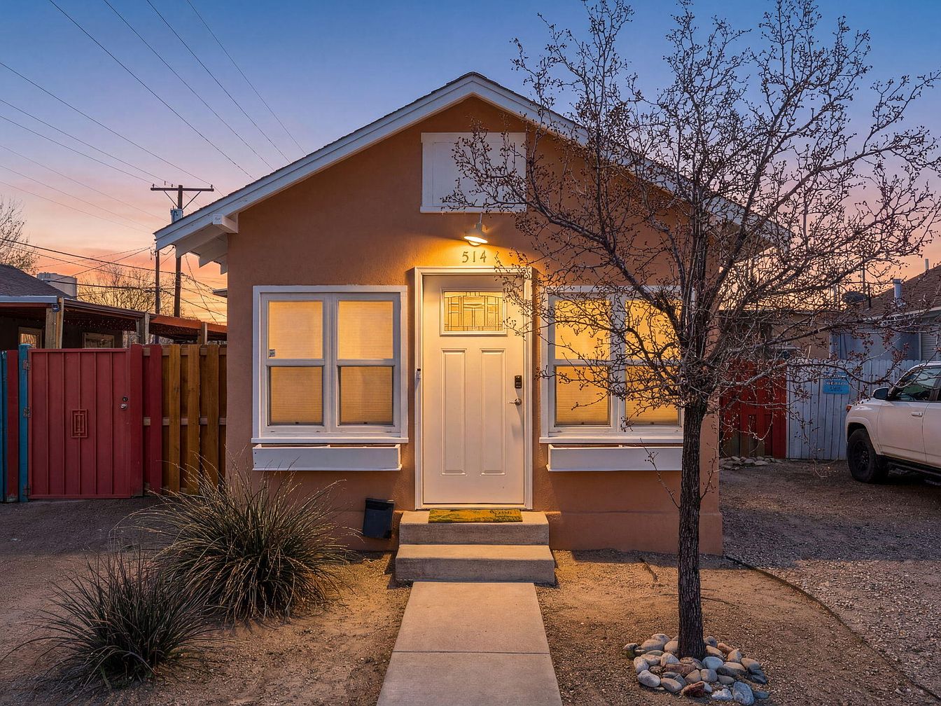 Charming 1901 Railworker’s Cottage in Albuquerque, New Mexico with Modern Comforts, Beautiful Wood Floors, and a Private Deck Oasis