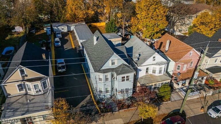 Spacious 1930 Two-Family Home in Passaic, New Jersey, Featuring Abundant Parking and Perfect for Investment Opportunities
