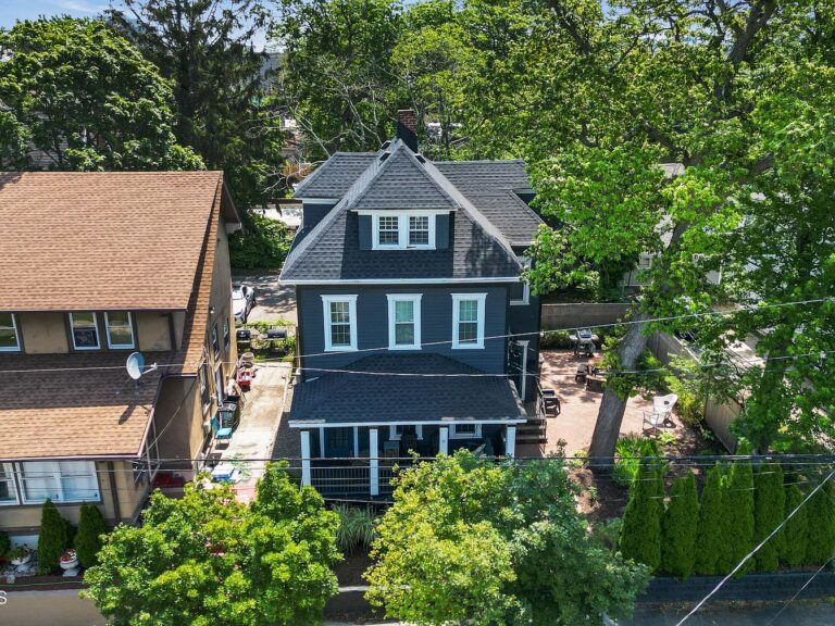 1900 Colonial Home in Asbury Park, New Jersey with Original Moldings, a Cozy Gas Fireplace, and a Private Patio for Entertaining