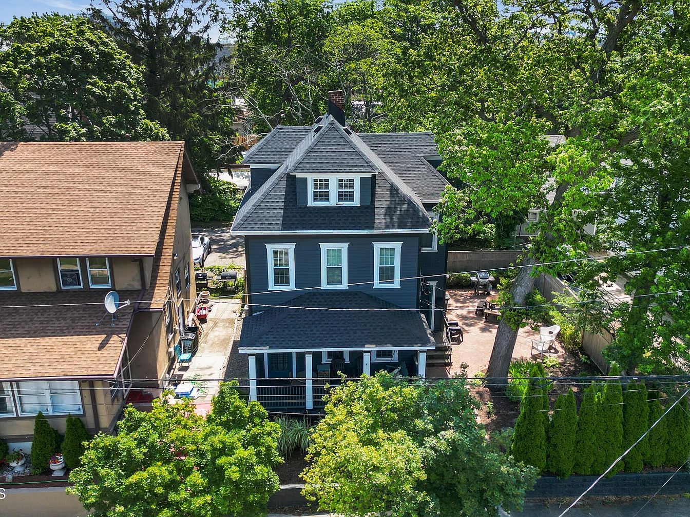 1900 Colonial Home in Asbury Park, New Jersey with Original Moldings, a Cozy Gas Fireplace, and a Private Patio for Entertaining