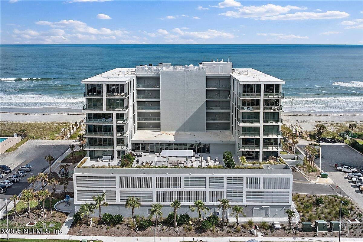 2024 Oceanfront Condo in Jacksonville Beach, Florida, Featuring Soaring Ceilings, Gourmet Kitchen, and Resort-Style Amenities