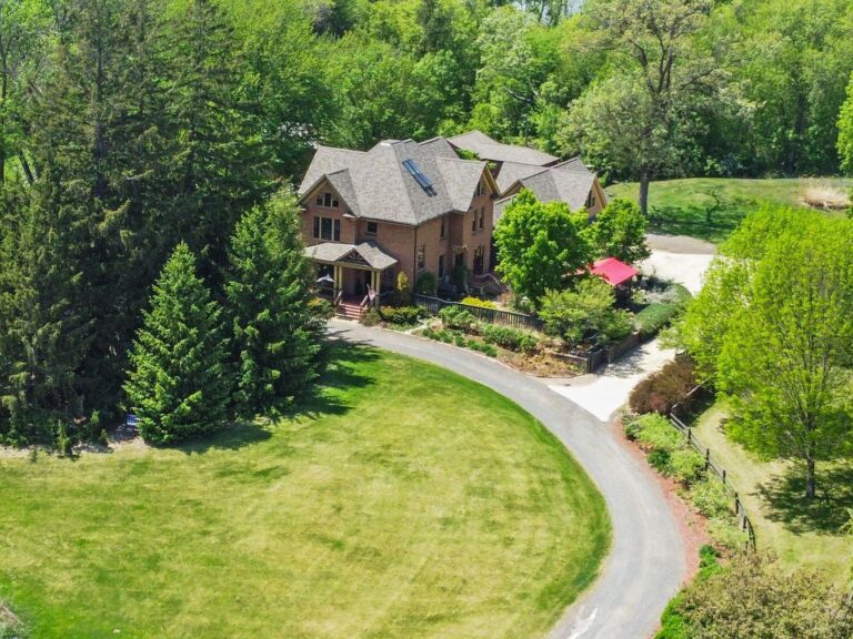Timeless 1903 Farmhouse in Cambridge, Minnesota, Featuring 5 Bedrooms, Expansive Living Spaces, and 10 Acres of Scenic Beauty