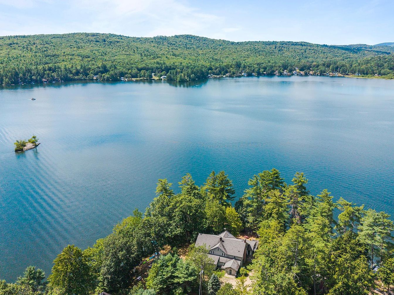 Explore This 1901 Lakeside Inn in Franklin, New Hampshire, with Panoramic Views, Expansive Living Spaces, and Room for 7 Bedrooms
