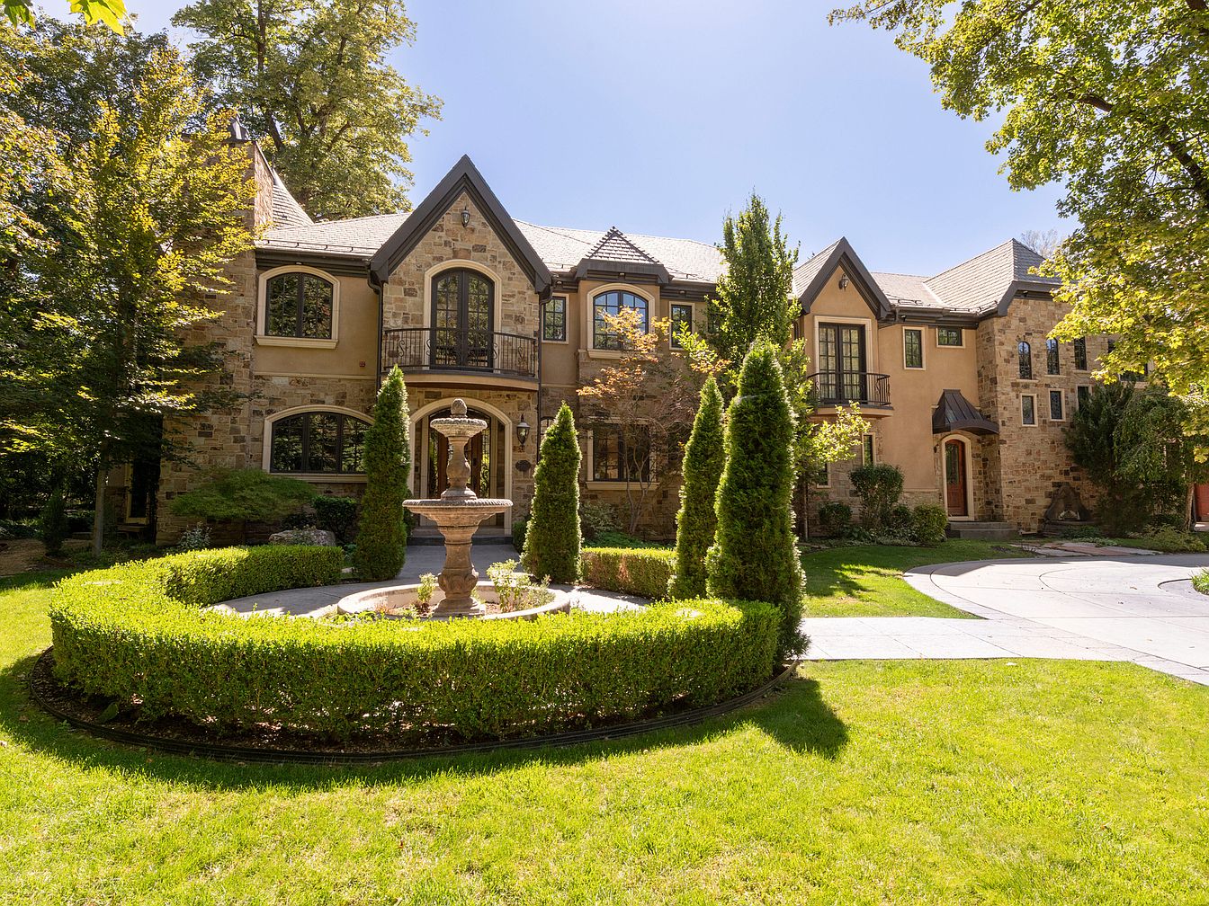 Discover an Exceptional $15M Estate in Holladay, Utah, Featuring 4.87 Acres of Landscapes, Meandering Streams, and a Log Cabin