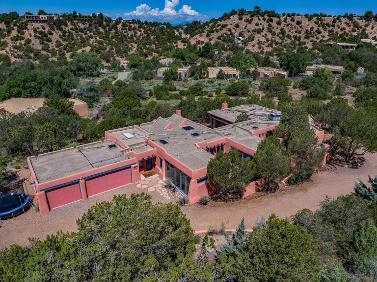 1993 Southwestern Compound in Santa Fe, New Mexico, Featuring Two Residences with Vigas and Saltillo Tile Floors on 1.2 Acres