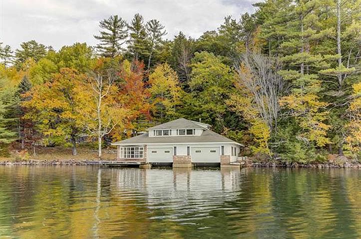 Historic 1929 Alton Bay Retreat in New Hampshire Featuring Two Lakefront Parcels, a Vintage Boathouse, and a Majestic Waterfall