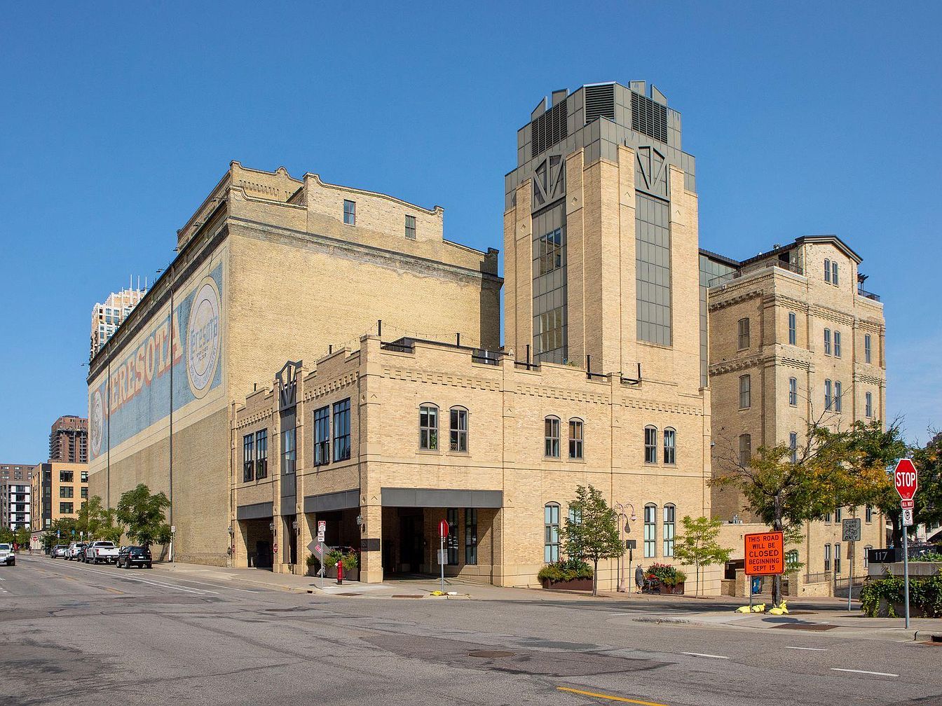 Visit This Urban 1900 Condo in Minneapolis, Minnesota, with Riverfront Views, Exposed Brick Walls, and a Custom Wet Bar