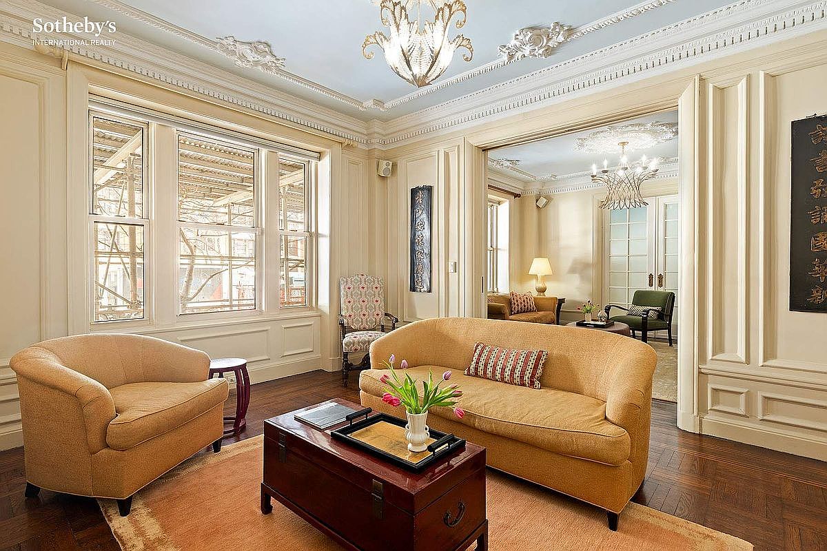 Timeless 1909 Prewar Condominium in New York, Featuring Ornate 10-Foot Ceilings, a Cozy Library, and Expansive Living Spaces
