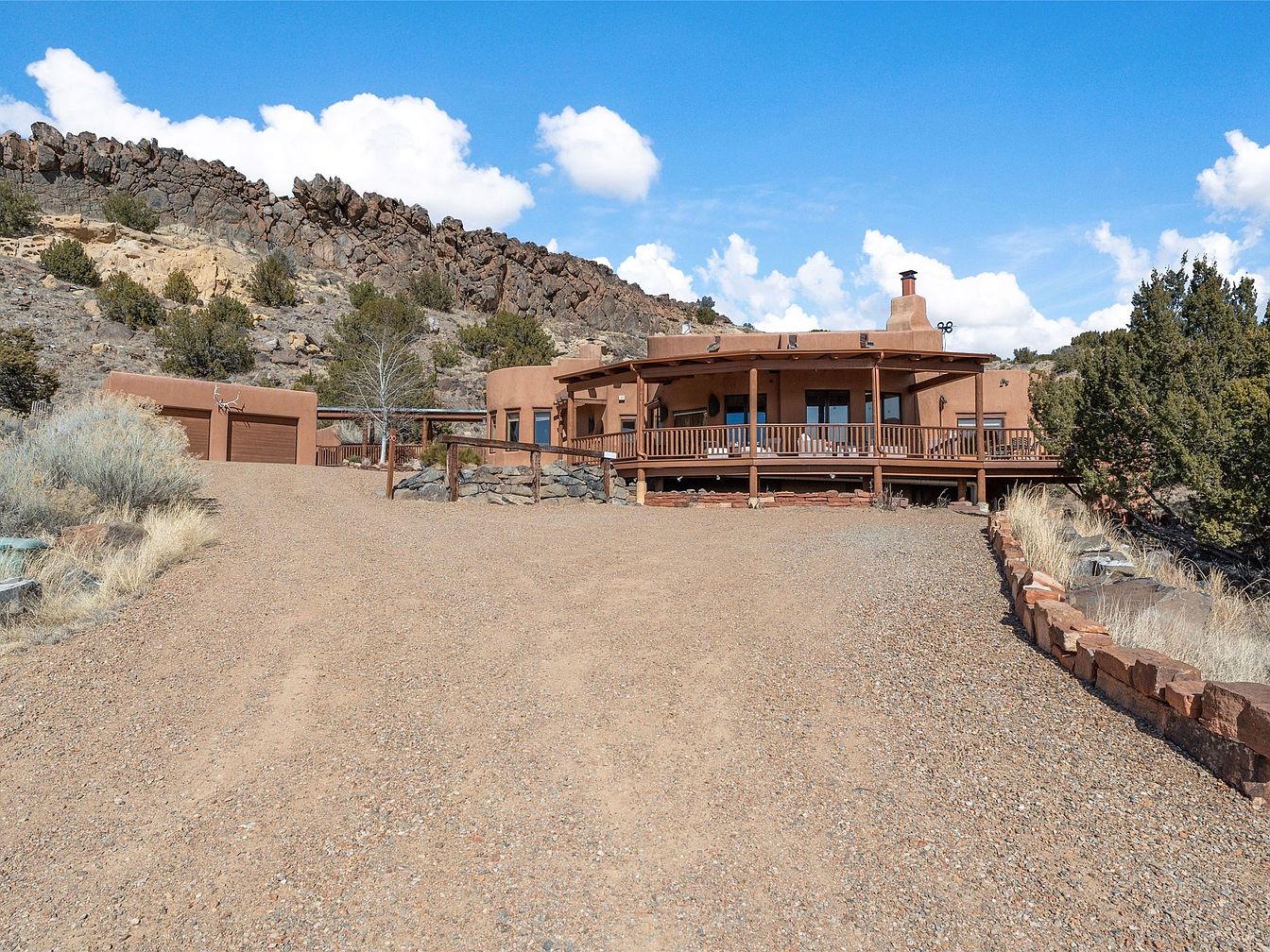 Tranquil 2003 Southwestern Elegance in Galisteo, New Mexico with Mountain Views, Viged Ceilings, and a Guest House on 11 Acres