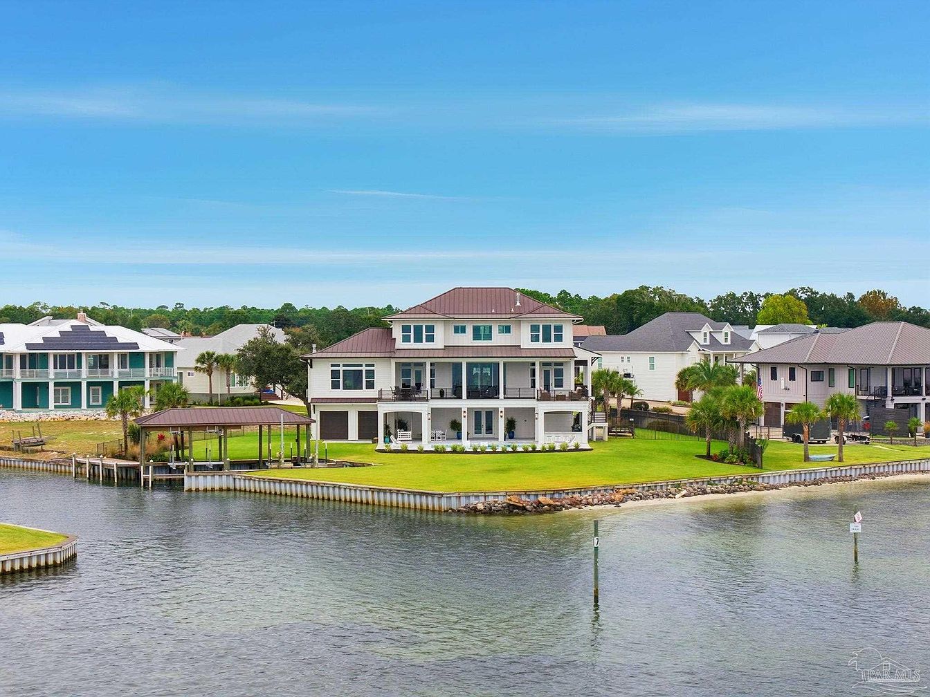 $5M Coastal Estate in Perdido Key, Florida Featuring 217 Feet of Waterfront, a Private Boat Basin, and a Chic Speakeasy Bar