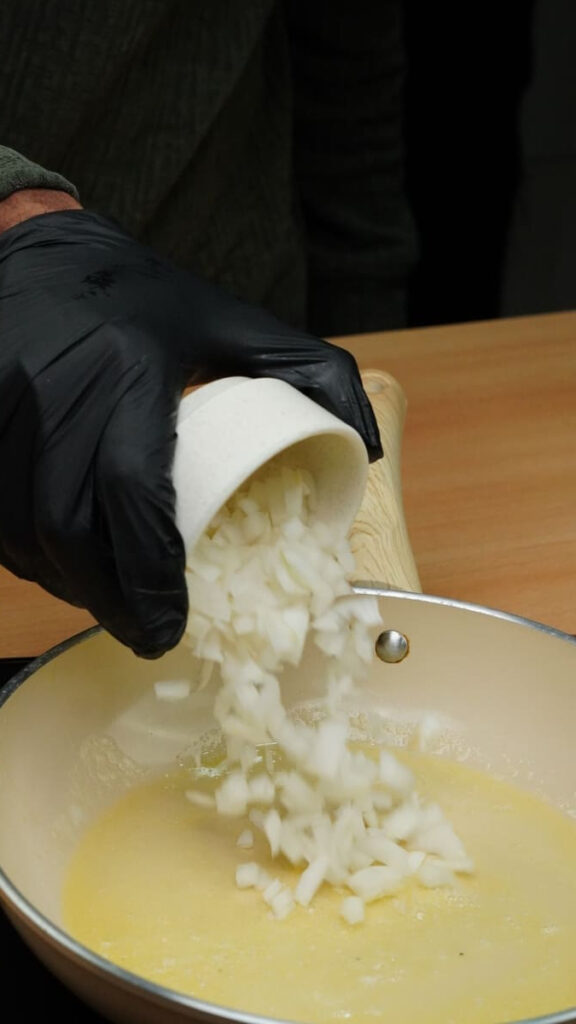 Minced garlic added to melted butter