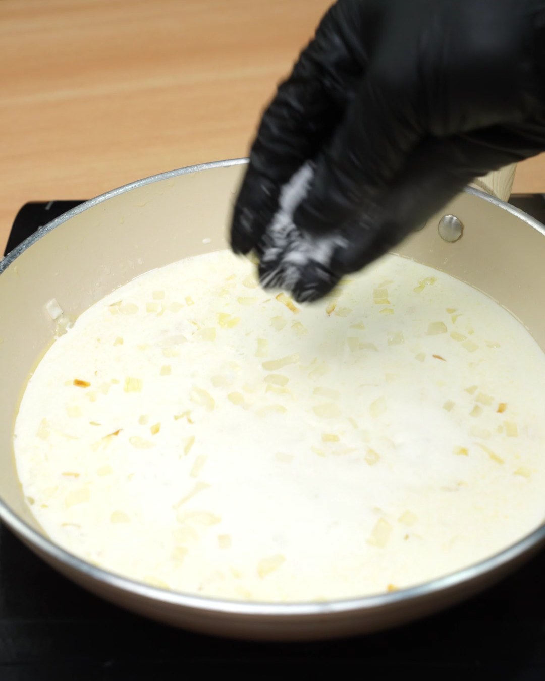 Grated Parmesan sprinkled into the cream sauce