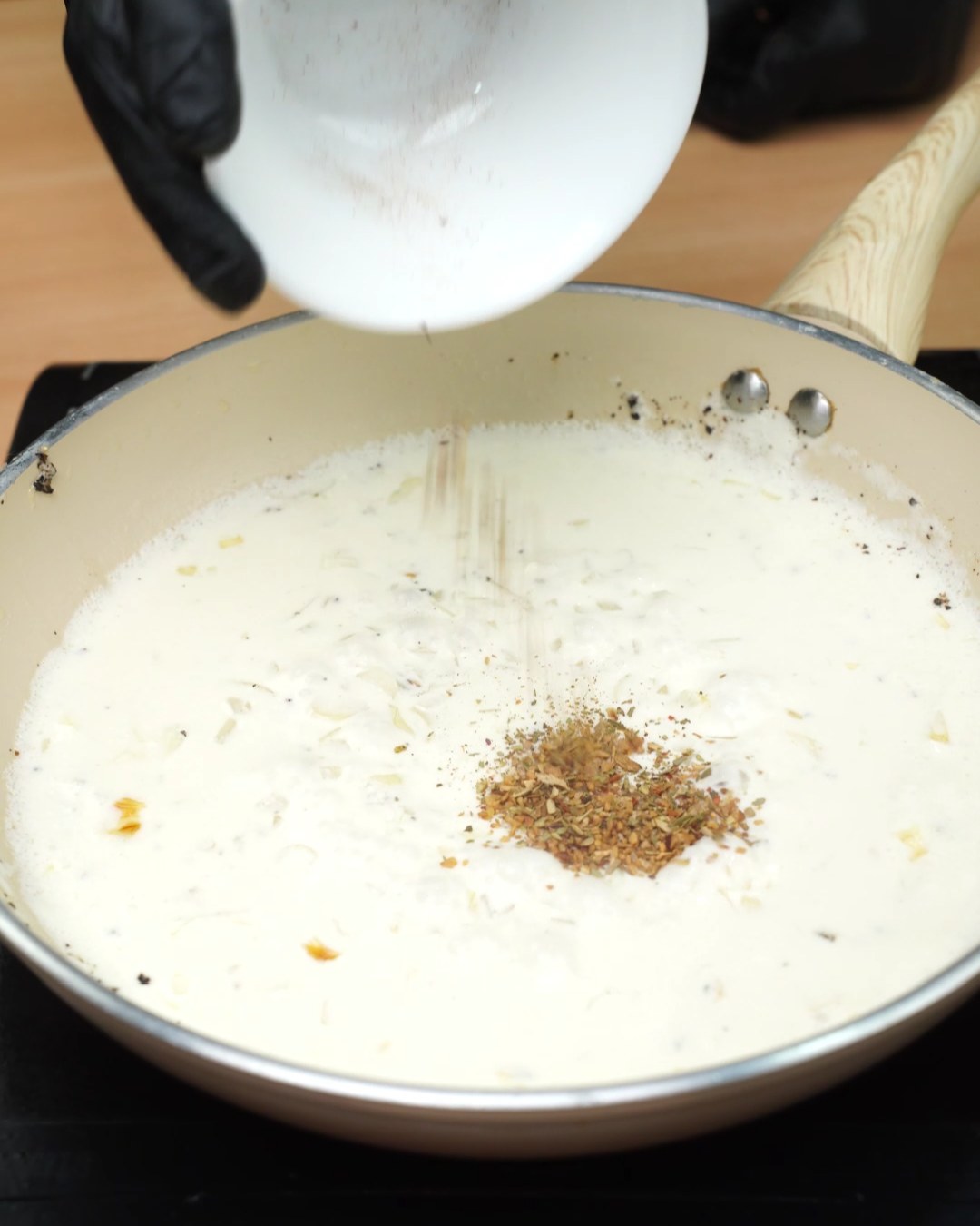Paprika added to the garlic Parmesan sauce