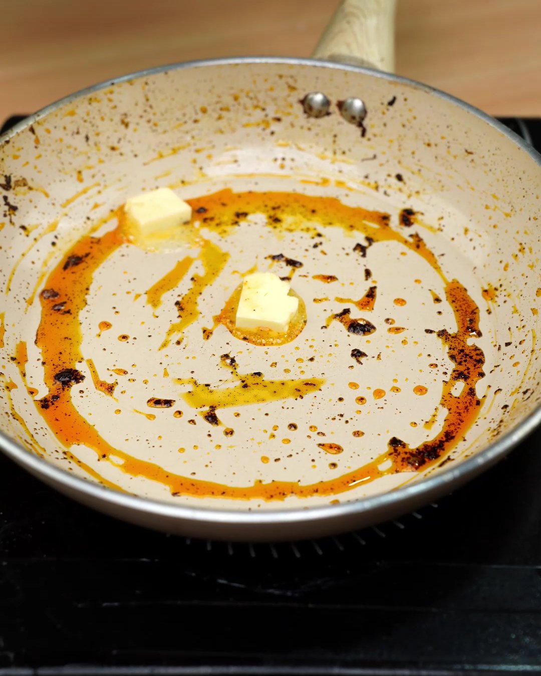 Fresh butter melting into the paprika drippings left in the skillet