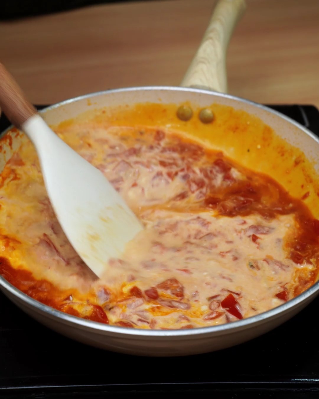 Heavy cream stirred into the tomato sauce